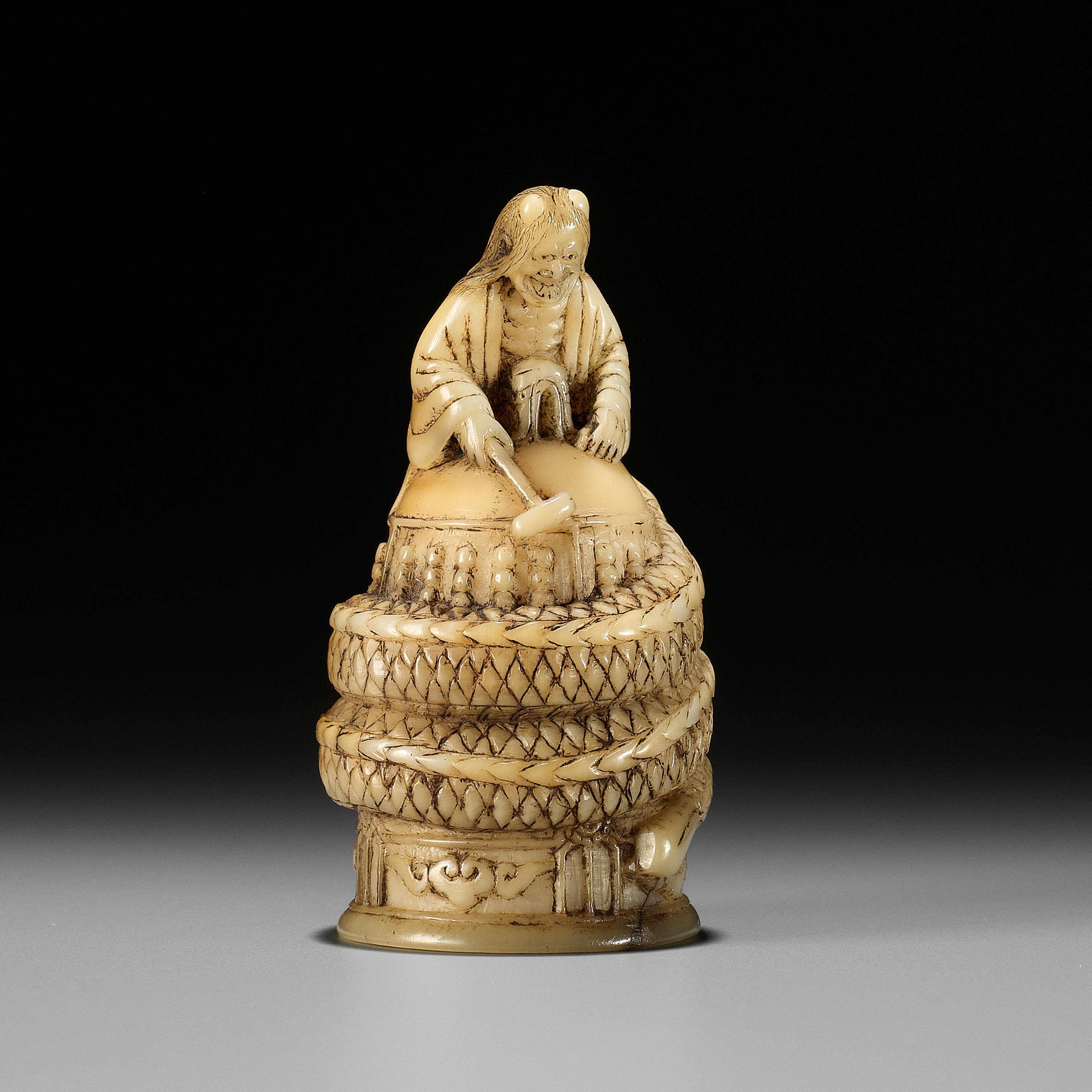 A RARE MARINE TOOTH NETSUKE OF KIYOHIME