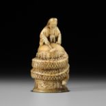 A RARE MARINE TOOTH NETSUKE OF KIYOHIME