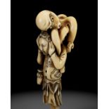 A RARE IVORY NETSUKE OF A DUTCHMAN WITH AN OCTOPUS