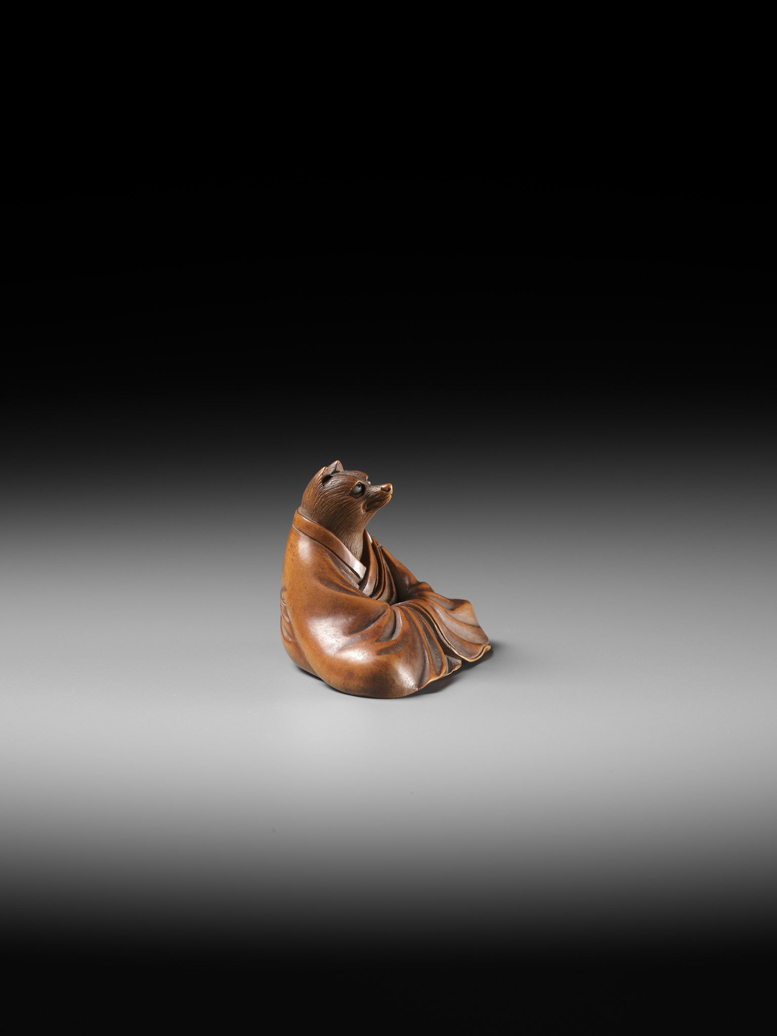 ANRAKU: A FINE AND HUMOROUS WOOD NETSUKE OF TANUKI DISGUISED AS A PRIEST - Image 10 of 14