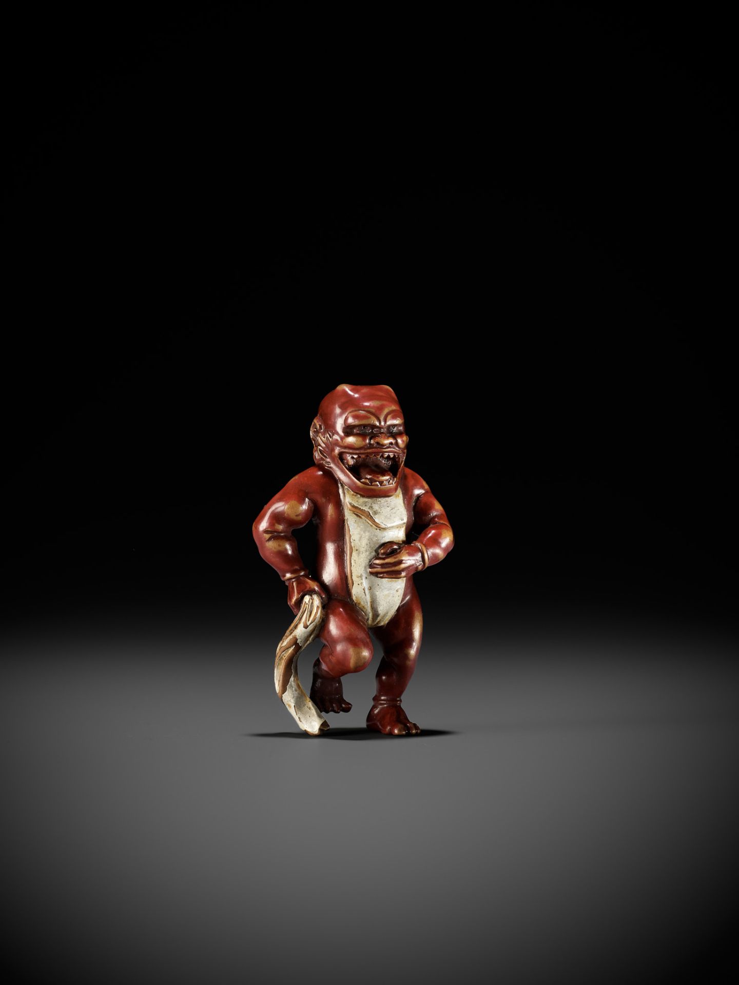 A RARE LACQUERED WOOD NETSUKE OF AN ONI TYING HIS FUNDOSHI - Image 2 of 12