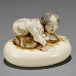 ISHIKAWA RENSAI: A SUPERB IVORY NETSUKE OF A FISHERMAN SUBDUING A FUGU (BLOWFISH)