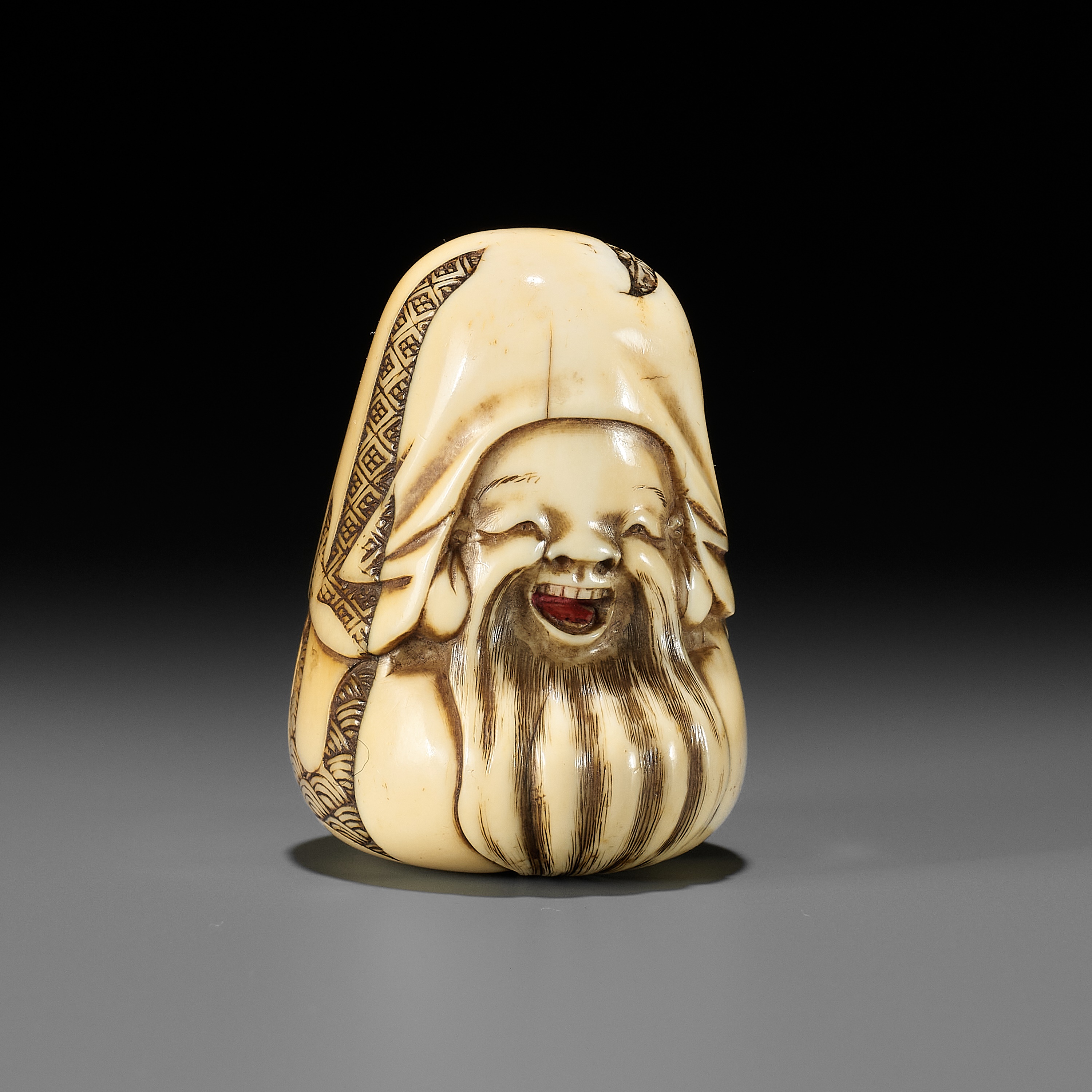 A FINE IVORY NETSUKE OF A JUROJIN DOLL, ATTRIBUTED TO HIDEMASA