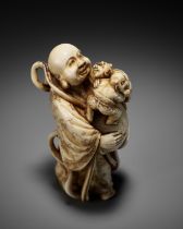 RYOZAN: AN AMUSING IVORY NETSUKE OF HOTEI WITH WRESTLING ONI