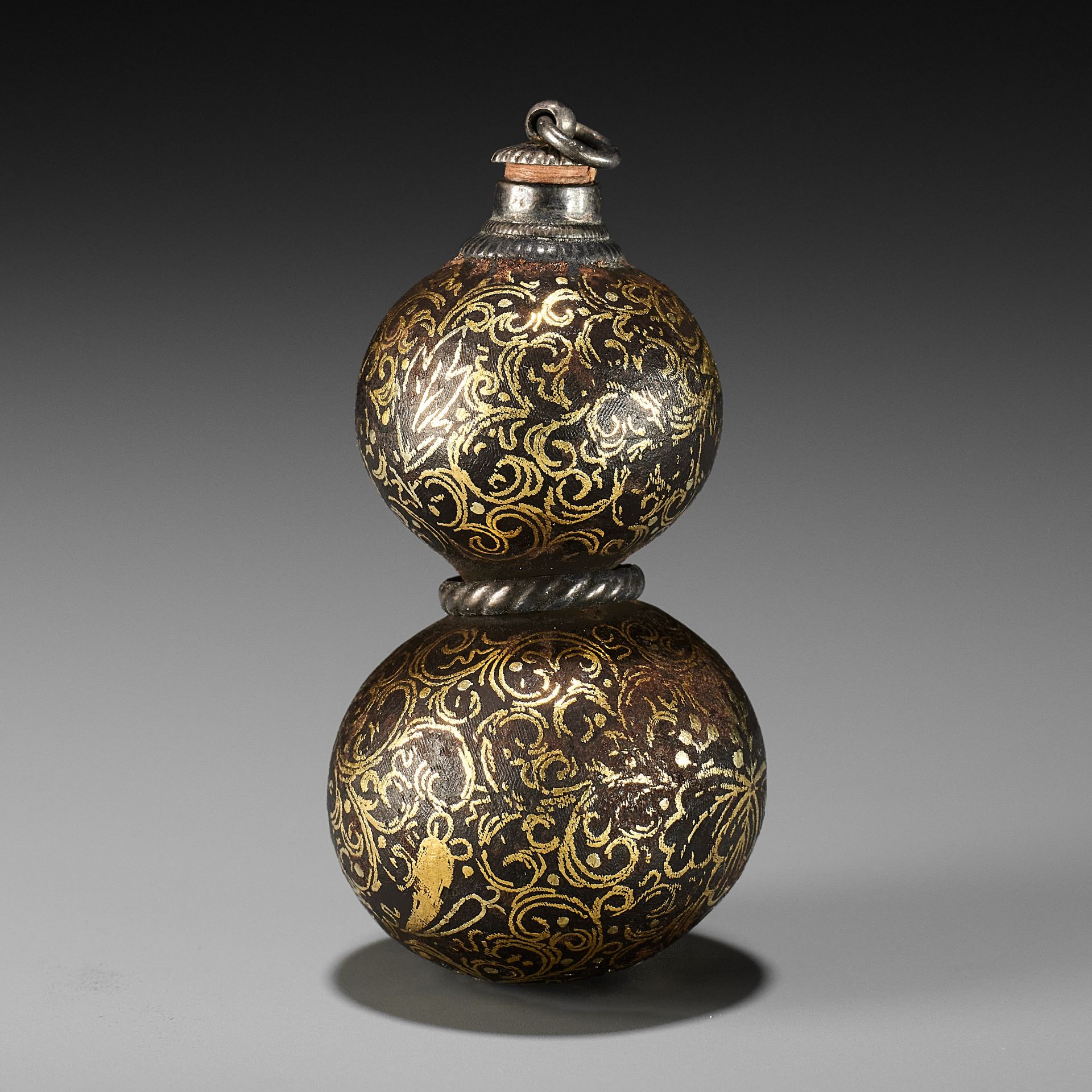 A RARE IRON GOURD-SHAPED NETSUKE WITH GOLD KIRI MON