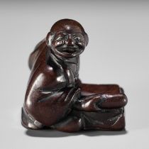 A FINE EDO SCHOOL WOOD NETSUKE OF FUKAI SHIDOKEN