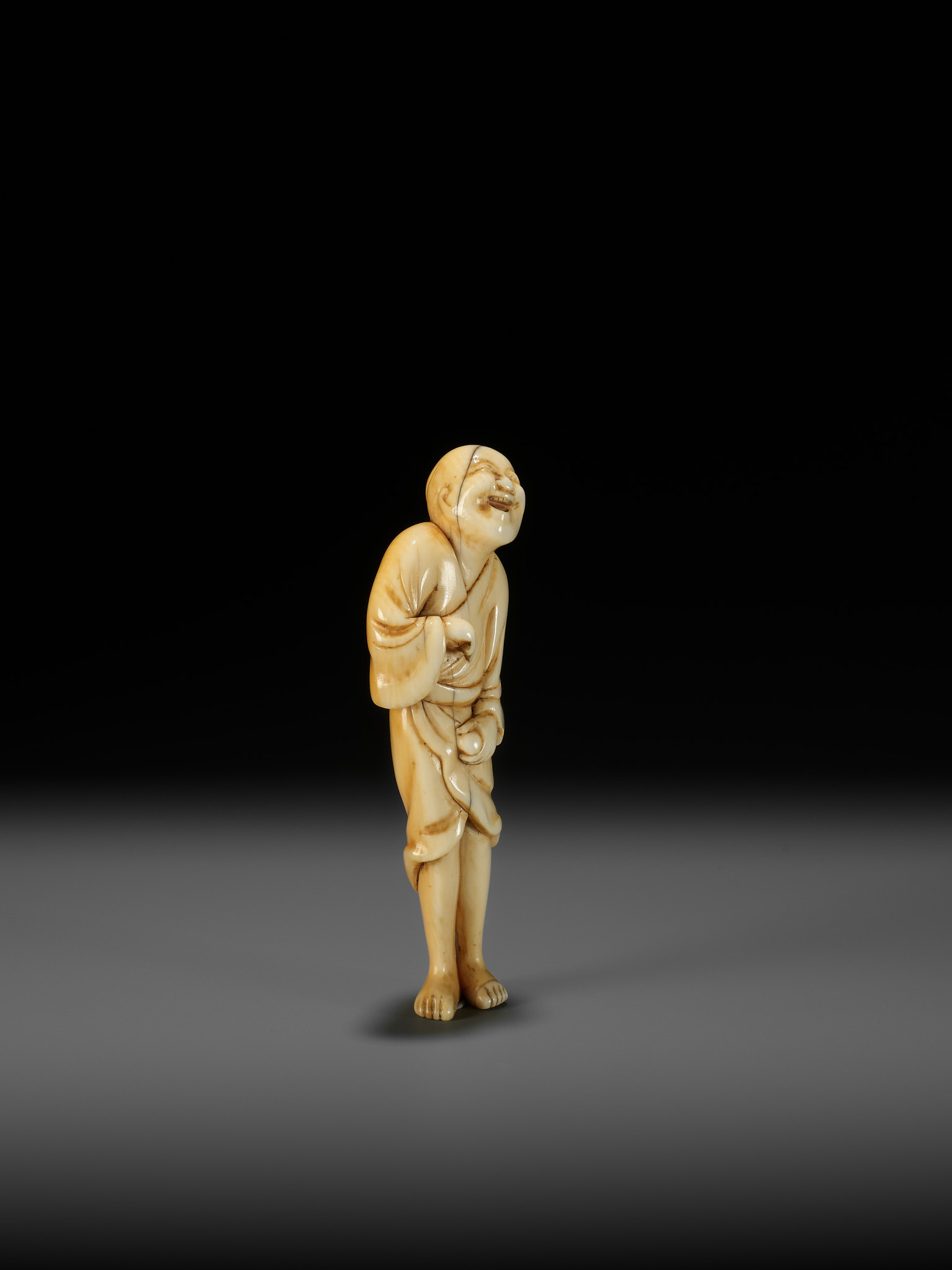 AN EARLY OSAKA SCHOOL IVORY NETSUKE OF A LAUGHING EGG-TESTER - Image 8 of 12