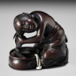 MIWA: A FINE INLAID WOOD NETSUKE OF A WOMAN WASHING HER HAIR