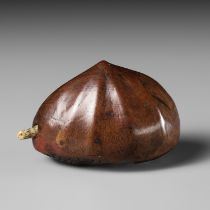 MINKO: A WOOD NETSUKE OF A CHESTNUT WITH A MOVEABLE MAGGOT