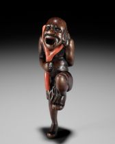 A POWERFUL WOOD NETSUKE OF A SOUTH SEA CORAL DIVER