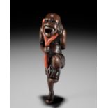 A POWERFUL WOOD NETSUKE OF A SOUTH SEA CORAL DIVER
