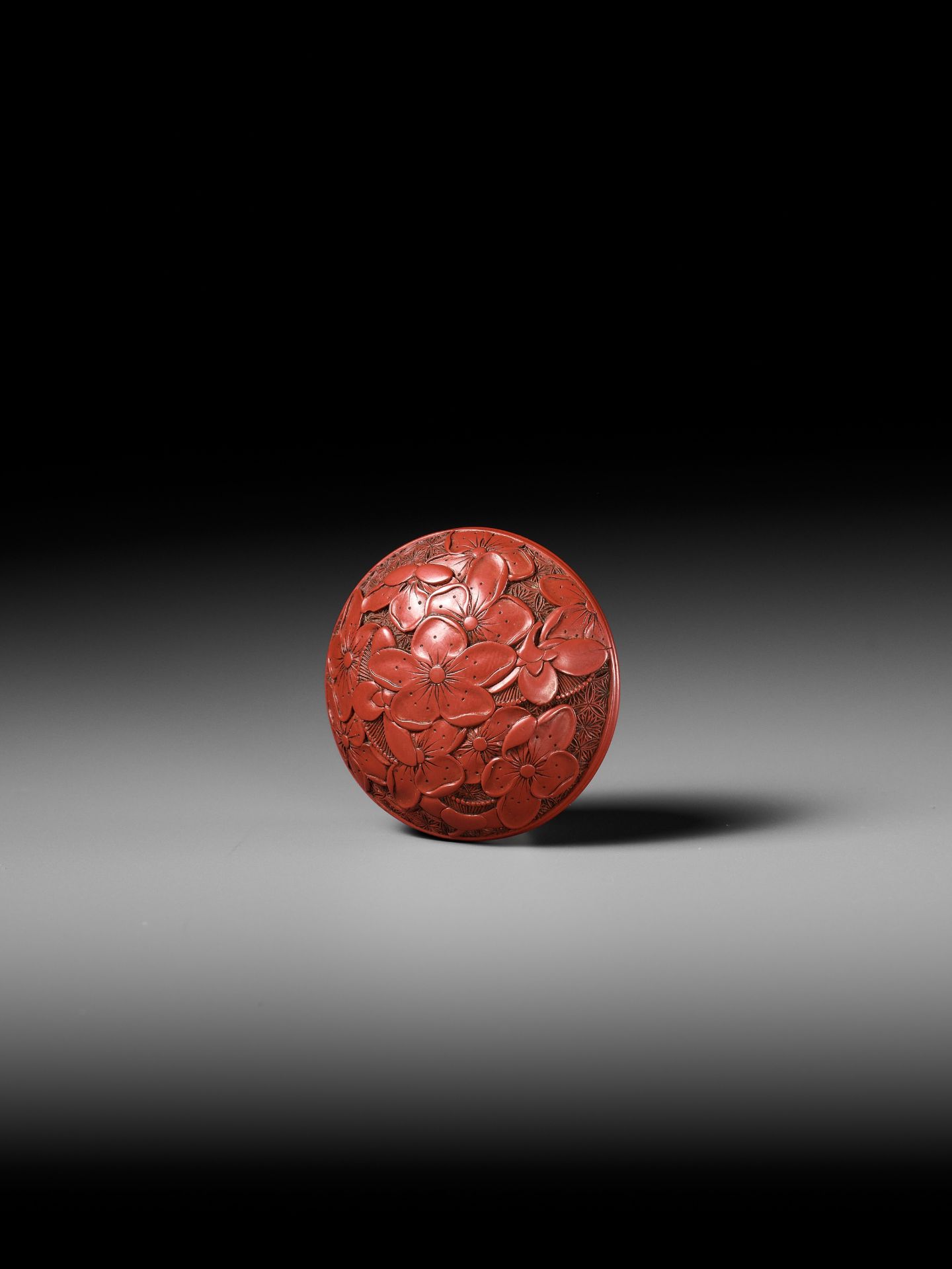 A FINE TSUISHU (CARVED RED LACQUER) MANJU NETSUKE WITH PEACH BLOSSOMS - Image 9 of 13