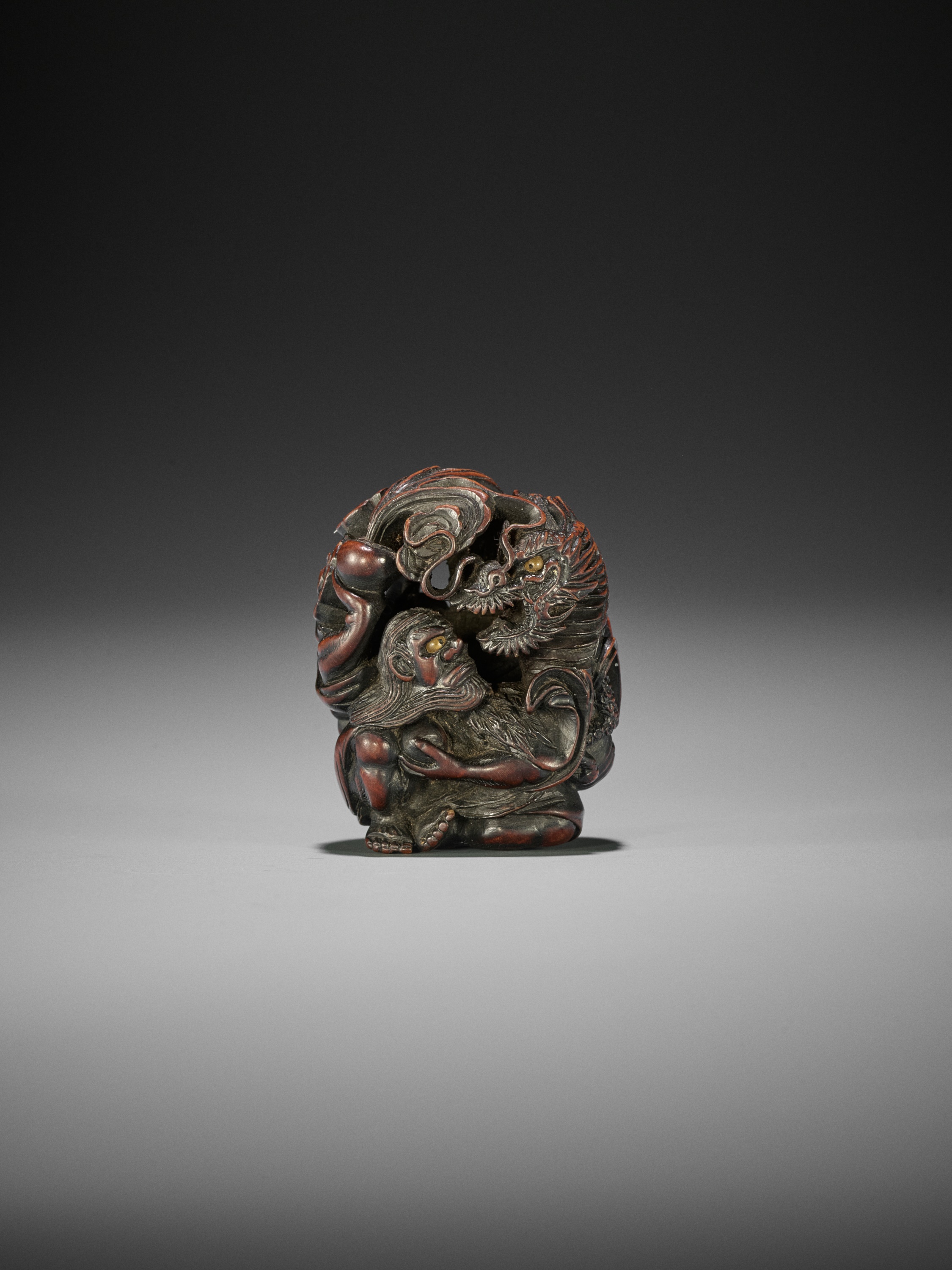 SADAKATA: A SUPERB WOOD NETSUKE OF RAKAN HANDAKA SONJA WITH DRAGON - Image 2 of 15