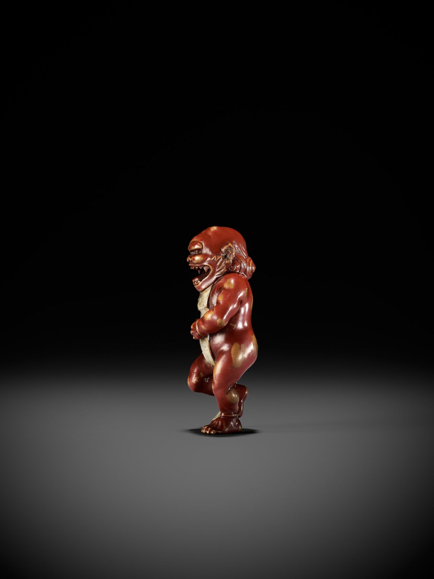 A RARE LACQUERED WOOD NETSUKE OF AN ONI TYING HIS FUNDOSHI - Image 9 of 12