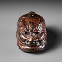 TESSAI: A LACQUERED WOOD GIGAKU MASK NETSUKE OF KONGO RIKISHI (NIO)