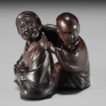 MIWA: A FINE WOOD NETSUKE OF A BLIND MASSEUR AND CLIENT