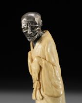 A SILVER AND ANTLER NETSUKE OF A GHOST, YUREI, ATTRIBUTED TO GEORGES WEIL