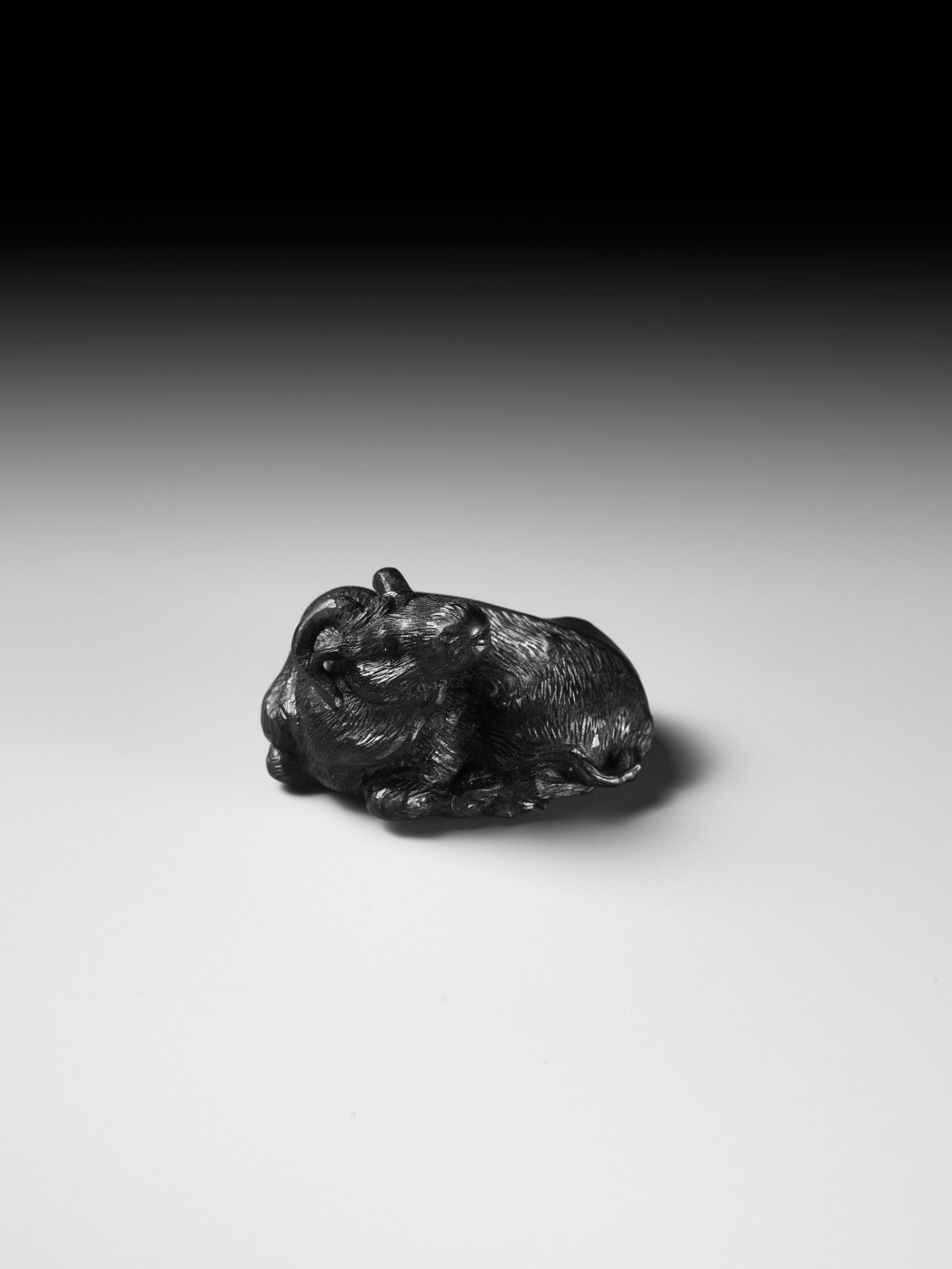 TATEKAWA KOSAI: AN EBONY WOOD NETSUKE OF A RECUMBENT OX - Image 11 of 13