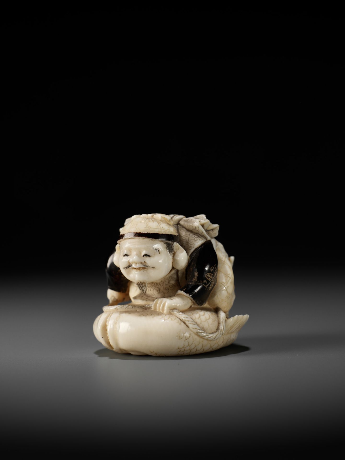 GYOKUMIN: A FINE TOKYO SCHOOL IVORY NETSUKE OF EBISU CATCHING A SEA BREAM - Image 10 of 12