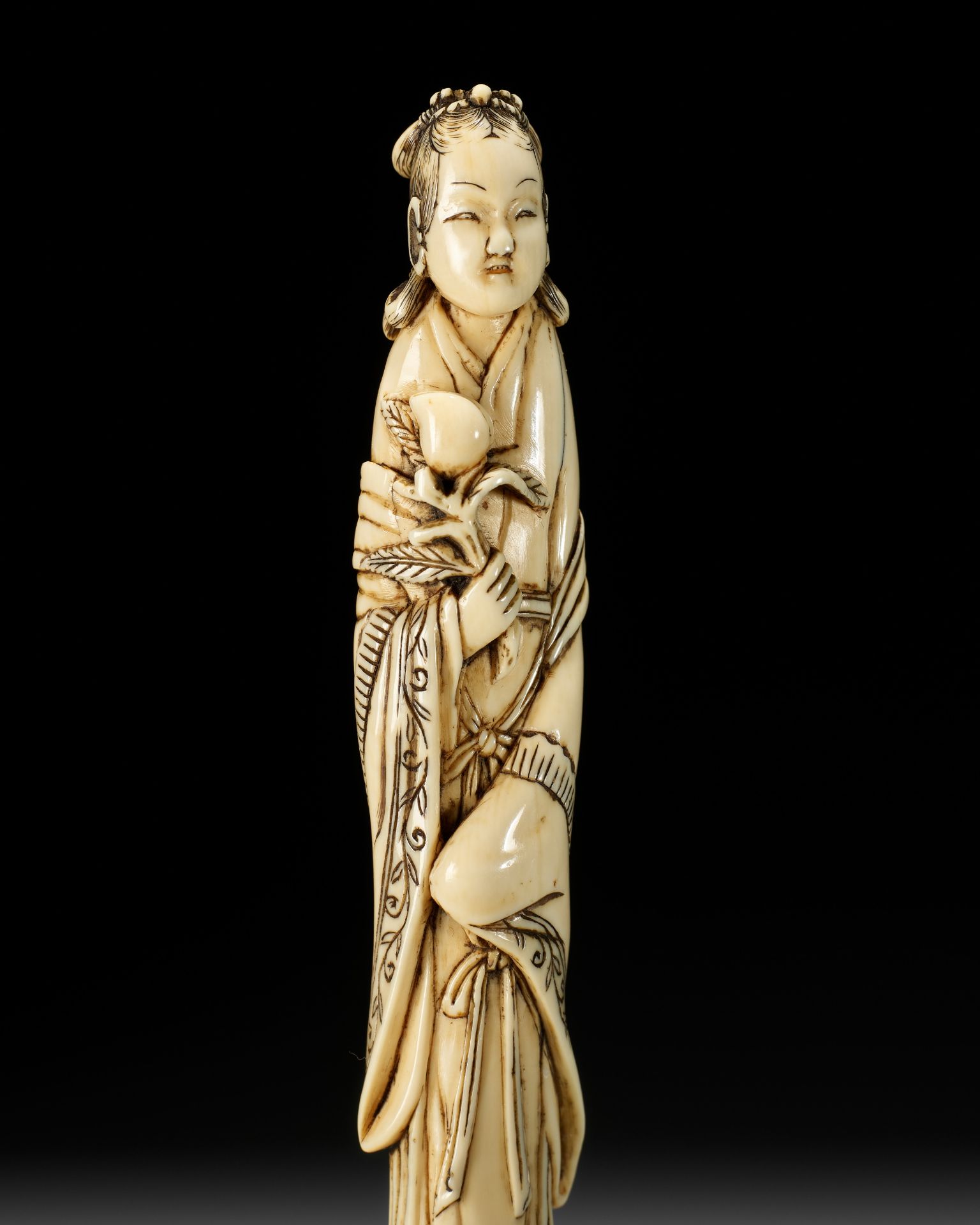 A TALL IVORY NETSUKE OF SEIOBO