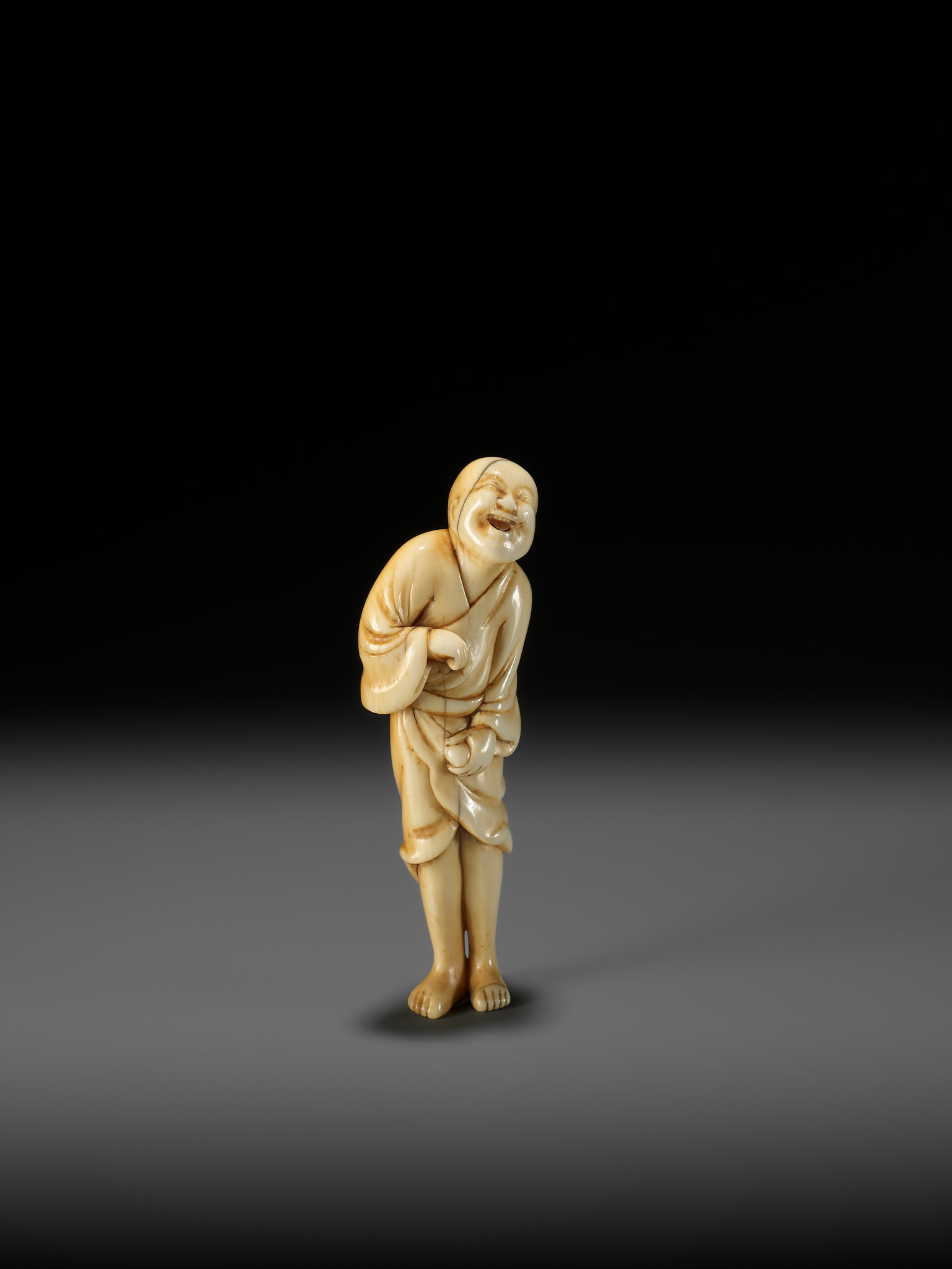 AN EARLY OSAKA SCHOOL IVORY NETSUKE OF A LAUGHING EGG-TESTER - Image 9 of 12