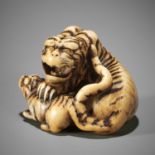 HAKURYU I: A SUPERB IVORY NETSUKE OF A TIGER AND CUB