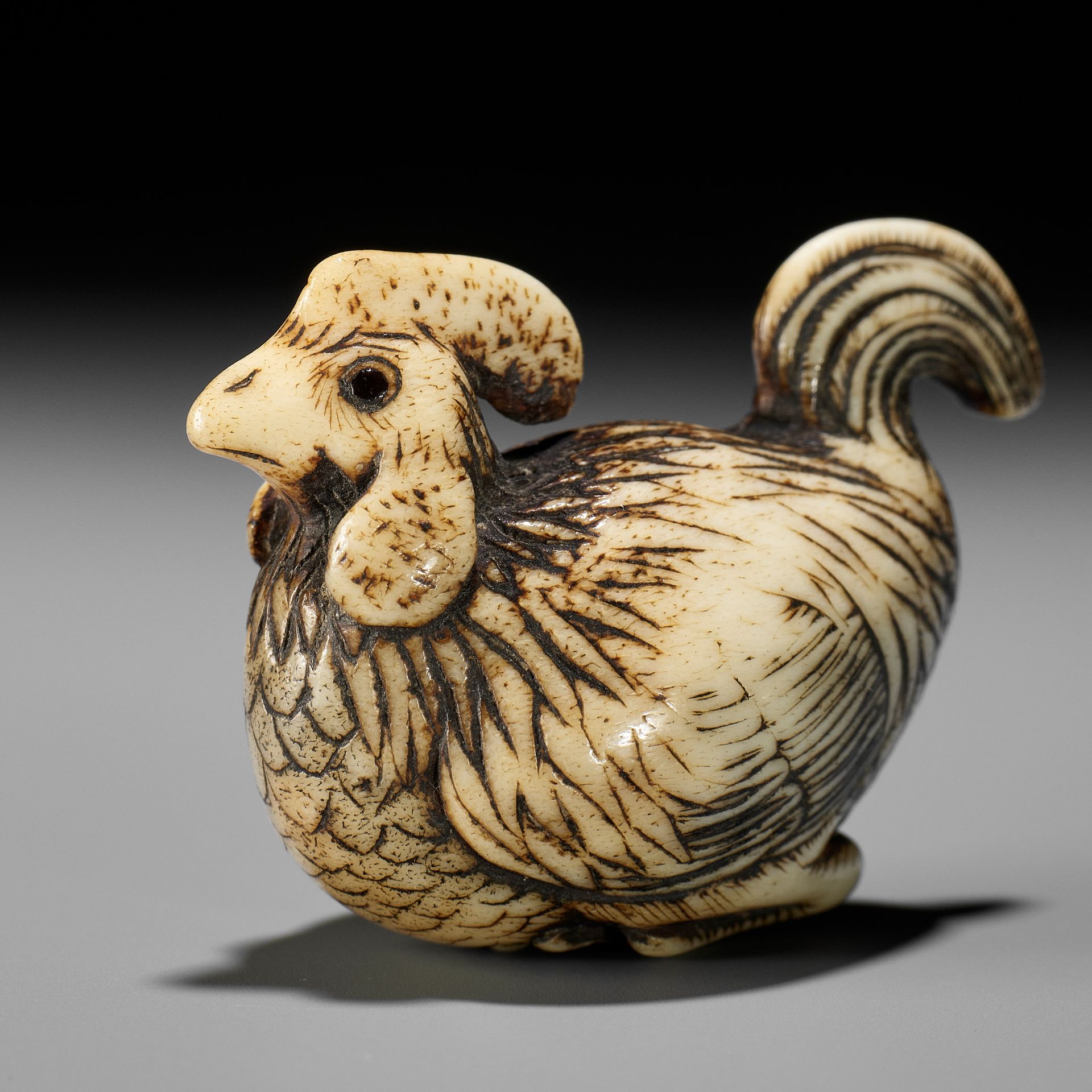 A RARE KYOTO SCHOOL ANTLER NETSUKE OF A COCKEREL