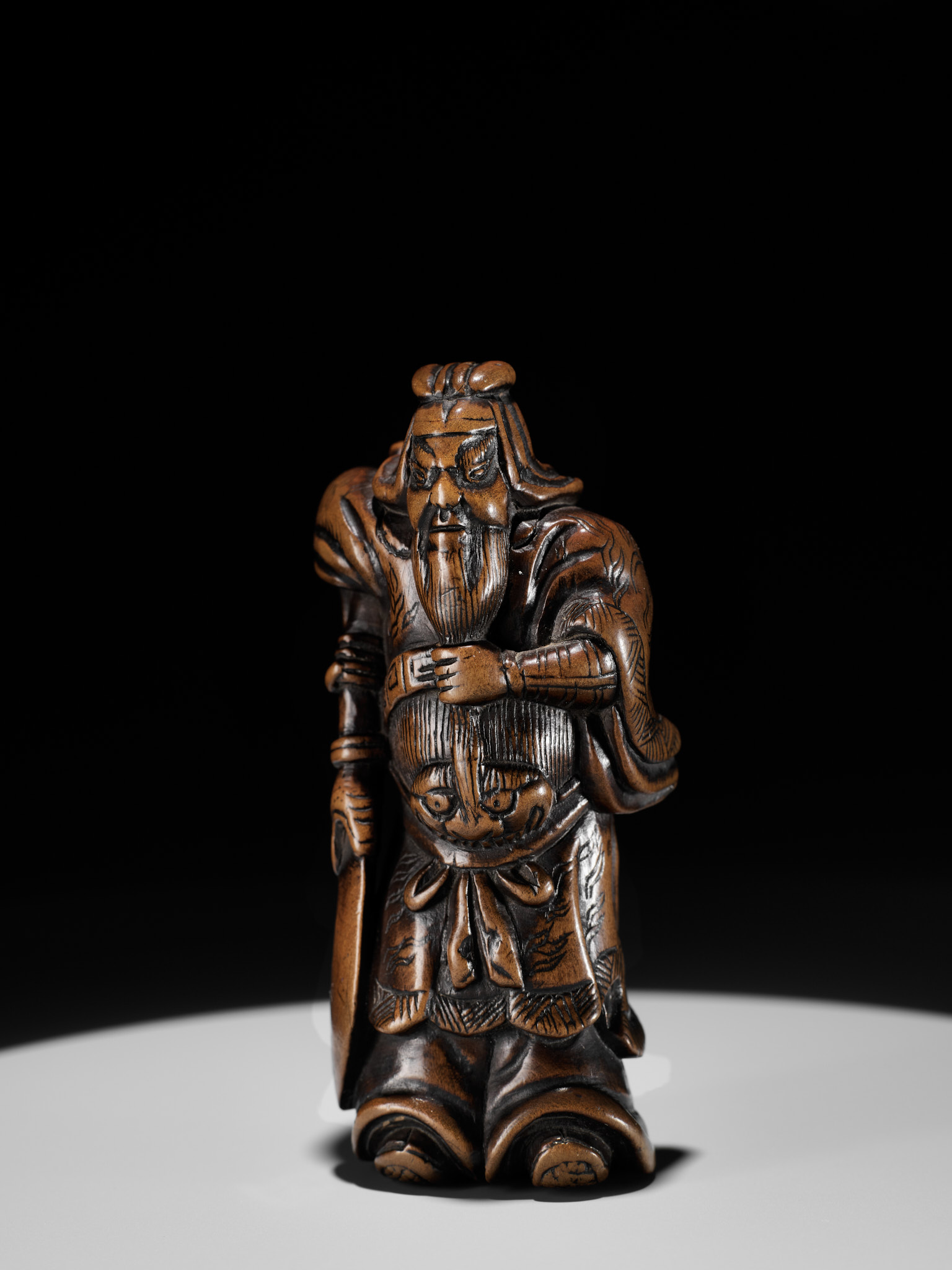 A POWERFUL WOOD NETSUKE OF KAN'U WITH HIS HALBERD - Image 8 of 9