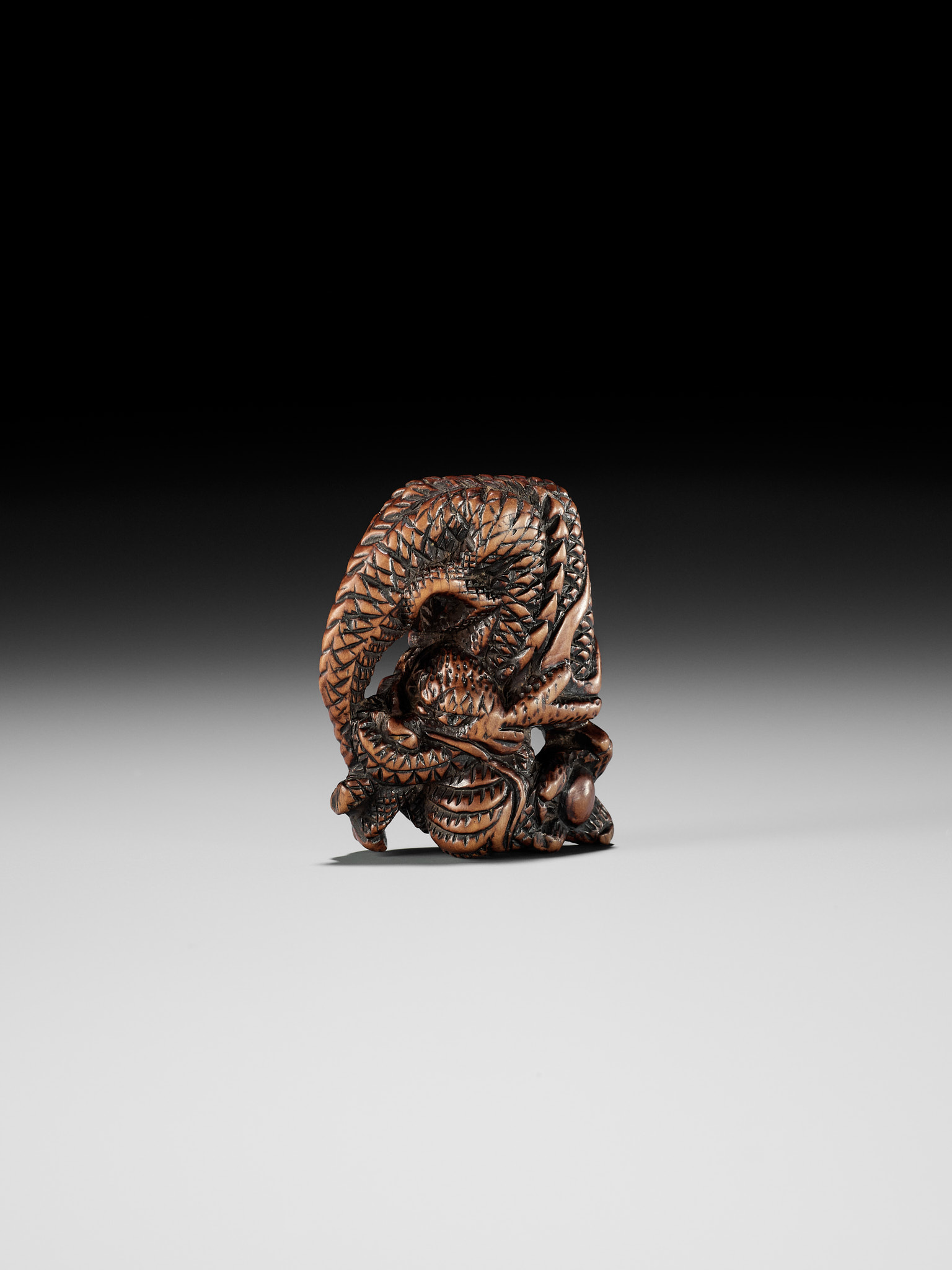 A POWERFUL WOOD NETSUKE OF A COILED DRAGON - Image 3 of 8