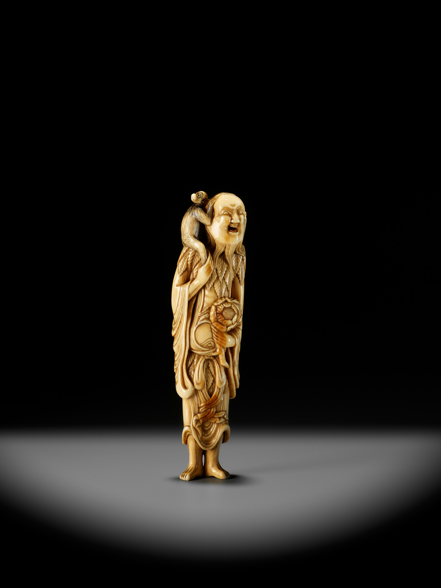 A SUPERB AND LARGE IVORY NETSUKE OF A SENNIN WITH A MONKEY - Image 2 of 13