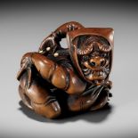 HOSHUNSAI MASAYUKI: A SUPERB INLAID WOOD NETSUKE OF AN ONI AT SETSUBUN