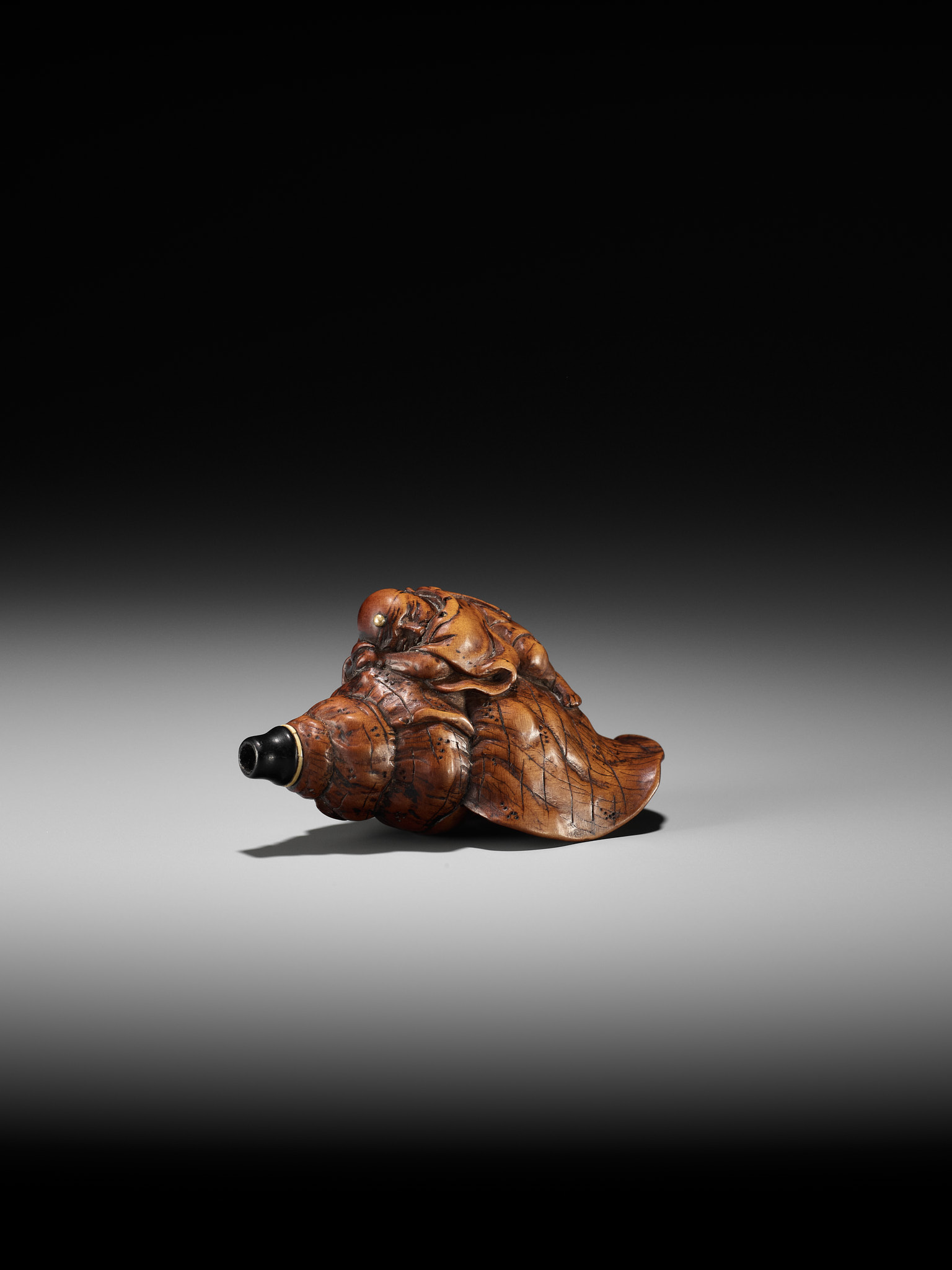 A WOOD NETSUKE OF BENKEI SLEEPING ON A CONCH (HORAGAI) - Image 5 of 10