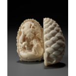 KAIGYOKU MASATSUGU: A FINE IVORY NETSUKE OF JO AND UBA INSIDE A PINECONE