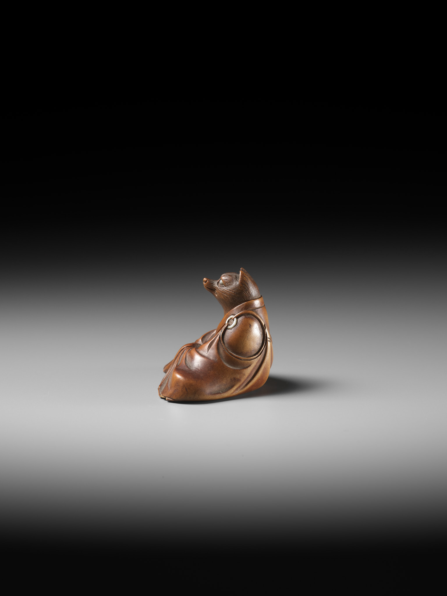 ANRAKU: A FINE AND HUMOROUS WOOD NETSUKE OF TANUKI DISGUISED AS A PRIEST - Image 9 of 14