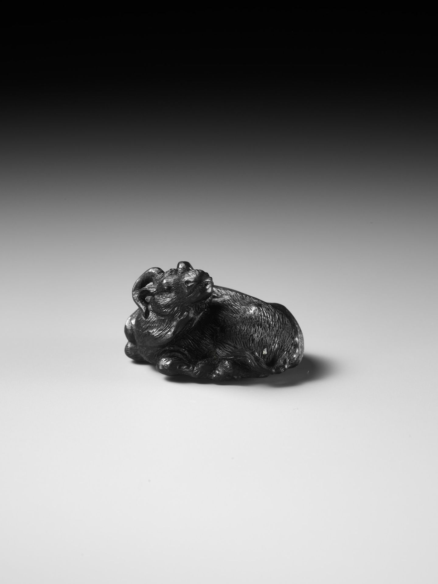 TATEKAWA KOSAI: AN EBONY WOOD NETSUKE OF A RECUMBENT OX - Image 8 of 13