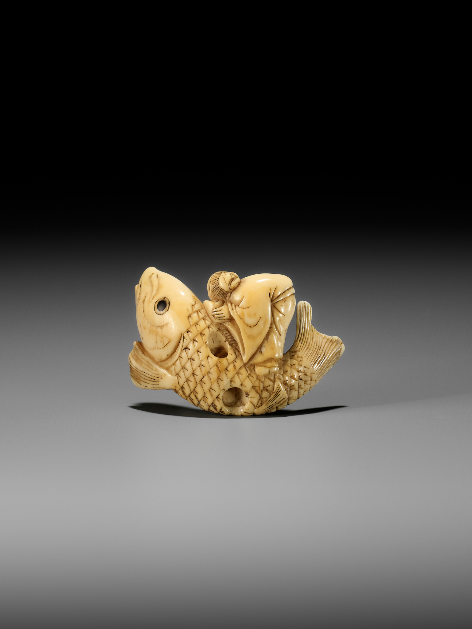 YOSHITSUGU: AN EARLY IVORY NETSUKE OF KINKO SENNIN ON A CARP - Image 6 of 14