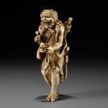 TOMOMASA: A FINE IVORY NETSUKE OF A REPENTANT ONI