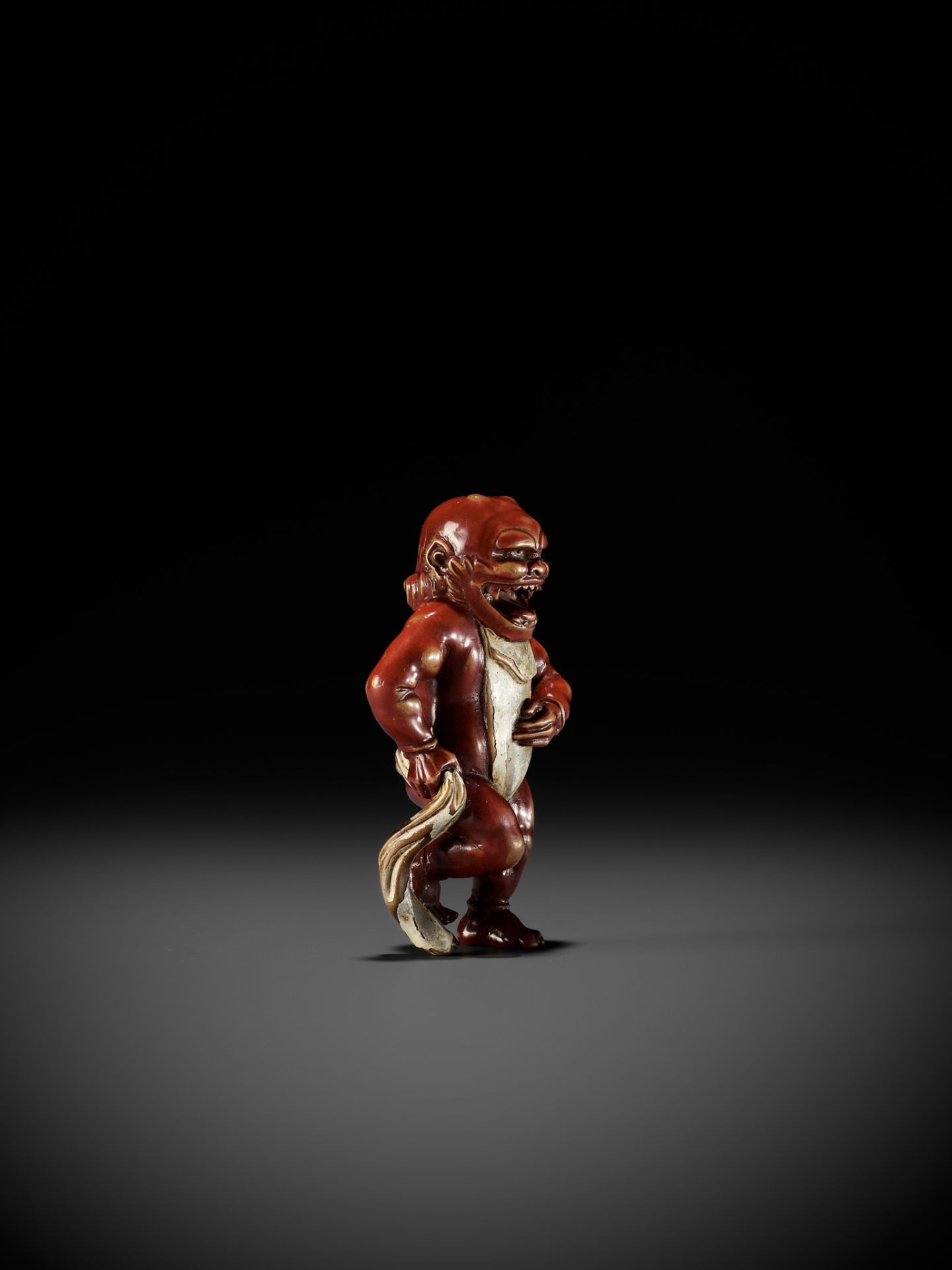 A RARE LACQUERED WOOD NETSUKE OF AN ONI TYING HIS FUNDOSHI - Image 10 of 12