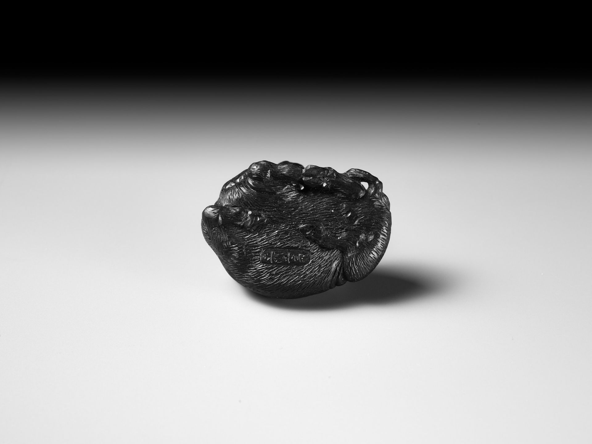 TATEKAWA KOSAI: AN EBONY WOOD NETSUKE OF A RECUMBENT OX - Image 12 of 13