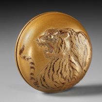 A FINE GOLD LACQUER MANJU NETSUKE OF A TIGER