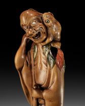 A SUPERB AND VERY LARGE INLAID WOOD NETSUKE OF GAMA SENNIN