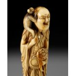 A SUPERB AND LARGE IVORY NETSUKE OF A SENNIN WITH A MONKEY