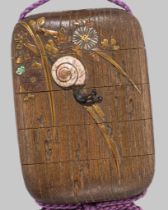 A FINE RITSUO STYLE CERAMIC-INLAID WOOD FOUR-CASE INRO WITH SNAILS AND BLOSSOMS