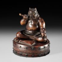 GYOKKOSAI: A HUMOROUS WOOD NETSUKE OF RAIJIN TAKING A SMOKE BREAK