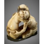 DORAKU: A SUPERB IVORY NETSUKE OF TWO WRESTLING DRUNKS