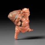 A VERY RARE SOLID CORAL NETSUKE OF FUJIN