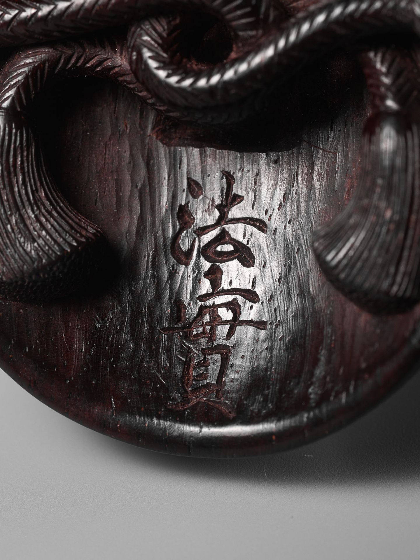 MEIKEISAI HOJITSU: A FINE DARK WOOD MASK NETSUKE OF OKAME - Image 12 of 13