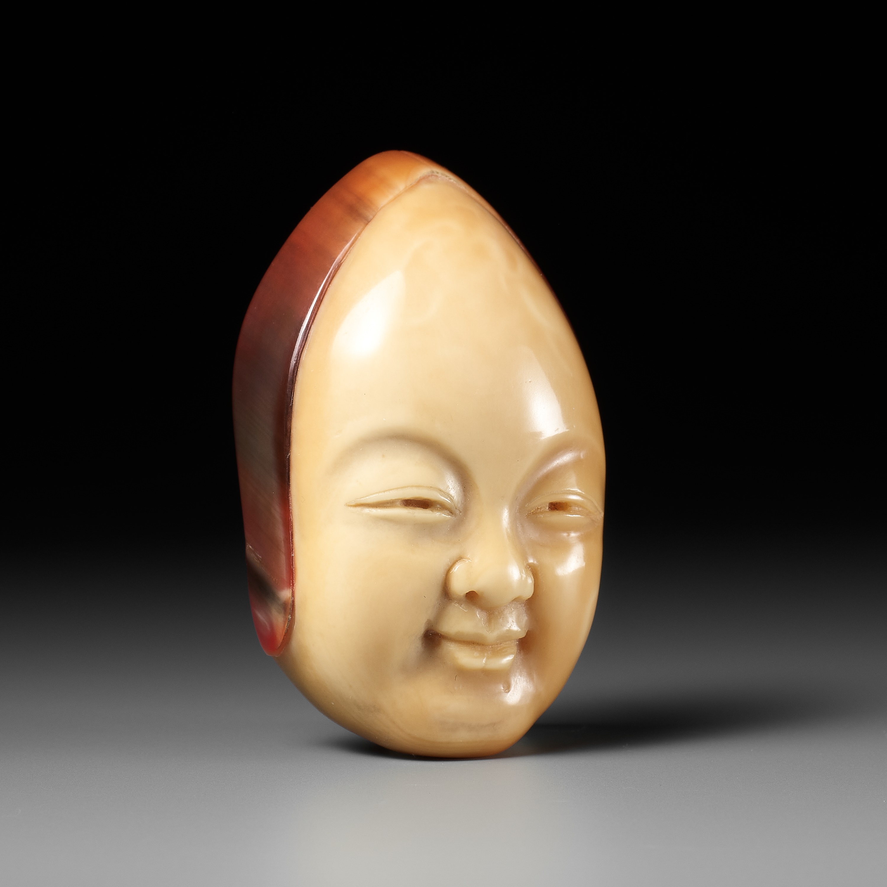 MEIGYOKUSAI: A RARE HONEN (HORNBILL) NETSUKE OF SHOJO