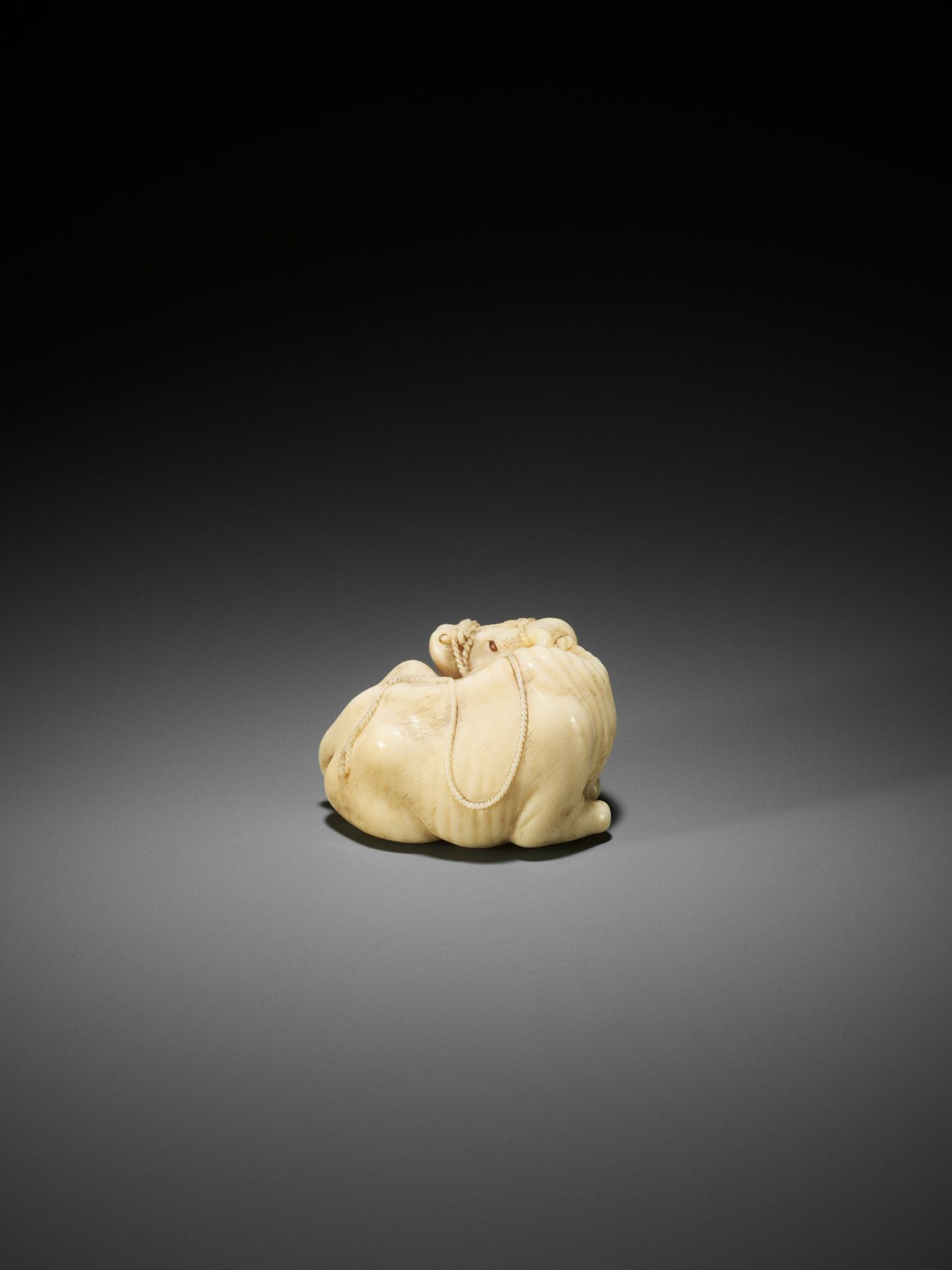 KAIGYOKUSAI MASATSUGU: A MASTERFUL AND IMPORTANT IVORY NETSUKE OF A RECUMBENT OX - Image 9 of 30