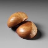 ANDO RYOKUZAN: A FINE LACQUERED IVORY NETSUKE OF TWO CHESTNUTS